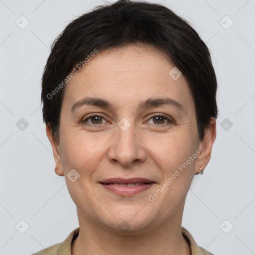 Joyful white adult female with short  brown hair and brown eyes