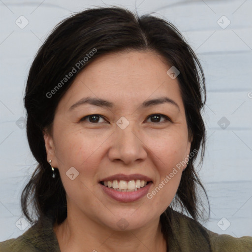 Joyful white adult female with medium  brown hair and brown eyes