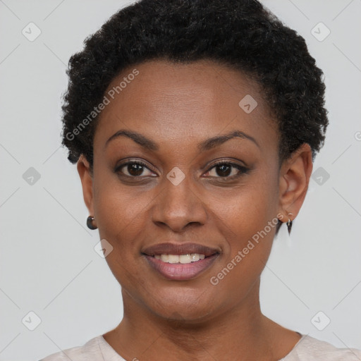 Joyful black young-adult female with short  brown hair and brown eyes