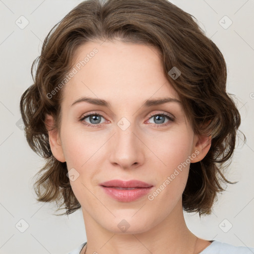 Joyful white young-adult female with medium  brown hair and green eyes