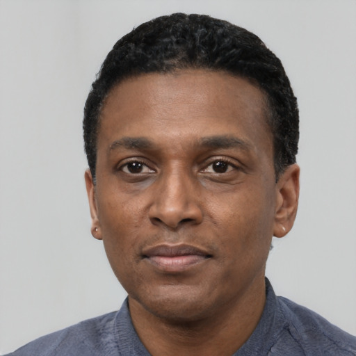 Neutral black young-adult male with short  black hair and brown eyes