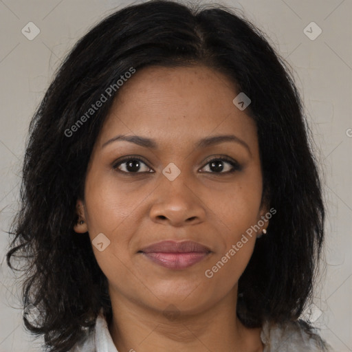 Joyful black adult female with medium  brown hair and brown eyes
