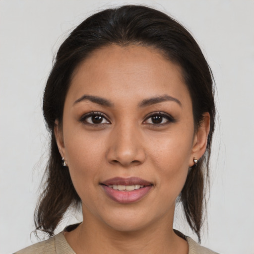 Joyful white young-adult female with medium  brown hair and brown eyes