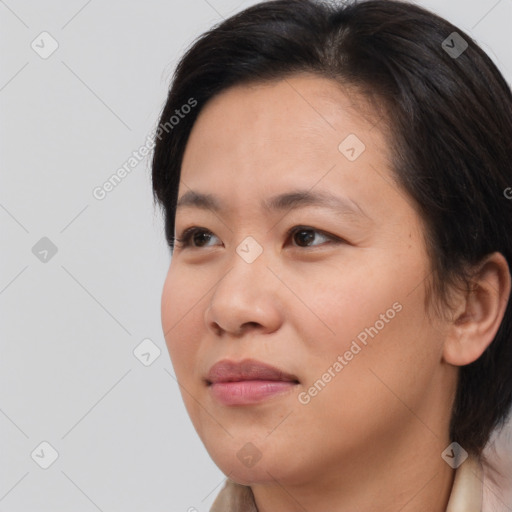 Joyful white young-adult female with medium  brown hair and brown eyes