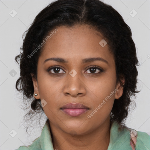 Joyful black young-adult female with long  brown hair and brown eyes