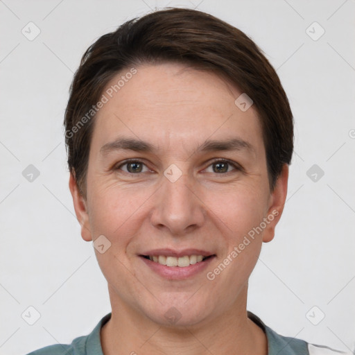 Joyful white adult female with short  brown hair and brown eyes