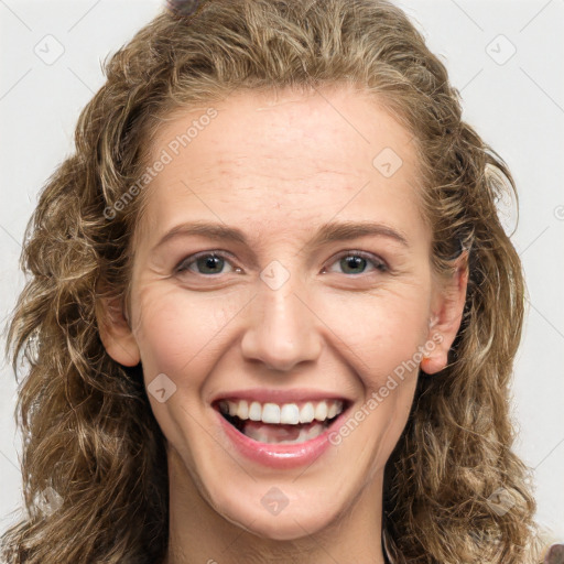 Joyful white young-adult female with long  brown hair and green eyes