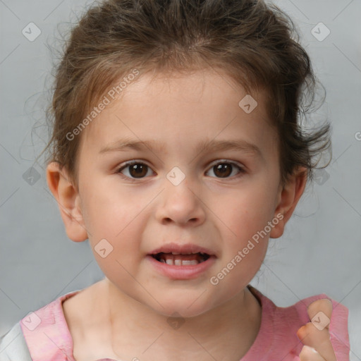 Joyful white child female with short  brown hair and brown eyes