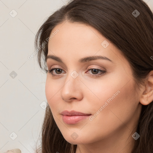 Neutral white young-adult female with long  brown hair and brown eyes