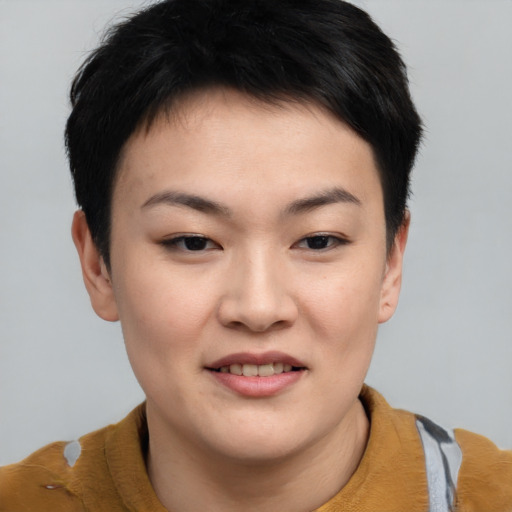 Joyful asian young-adult female with short  brown hair and brown eyes