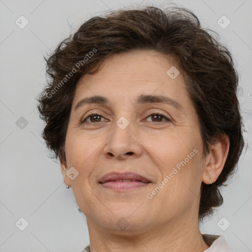 Joyful white adult female with short  brown hair and brown eyes