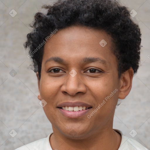 Joyful latino young-adult male with short  brown hair and brown eyes