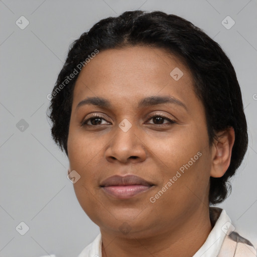 Joyful latino adult female with short  black hair and brown eyes