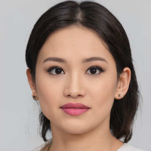 Neutral latino young-adult female with medium  black hair and brown eyes