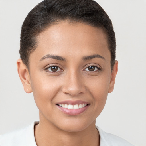 Joyful white young-adult female with short  brown hair and brown eyes