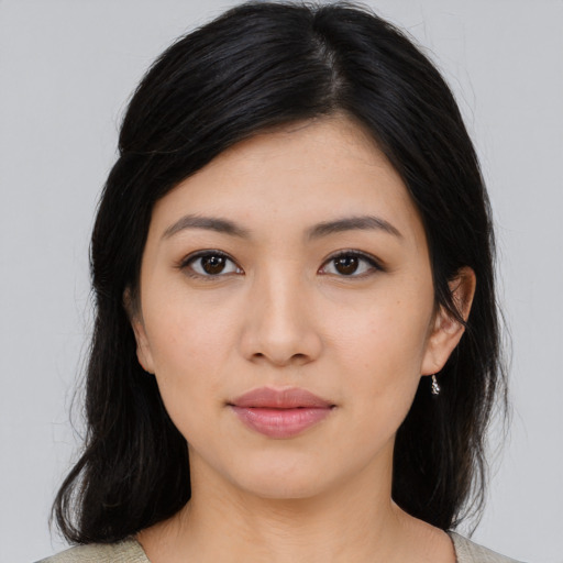 Joyful asian young-adult female with medium  black hair and brown eyes