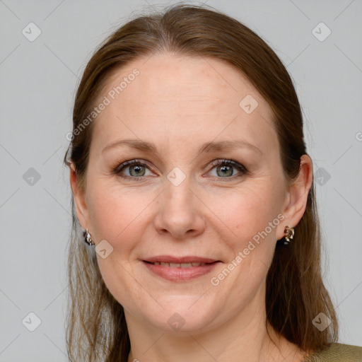 Joyful white adult female with medium  brown hair and grey eyes