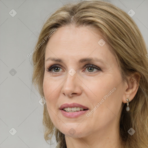 Joyful white adult female with medium  brown hair and grey eyes