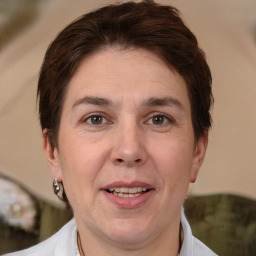 Joyful white adult female with short  brown hair and brown eyes