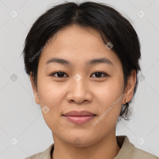 Joyful asian young-adult female with medium  brown hair and brown eyes