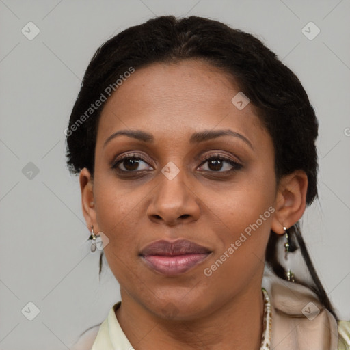 Joyful black adult female with short  brown hair and brown eyes