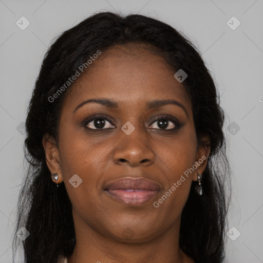 Joyful black young-adult female with long  brown hair and brown eyes