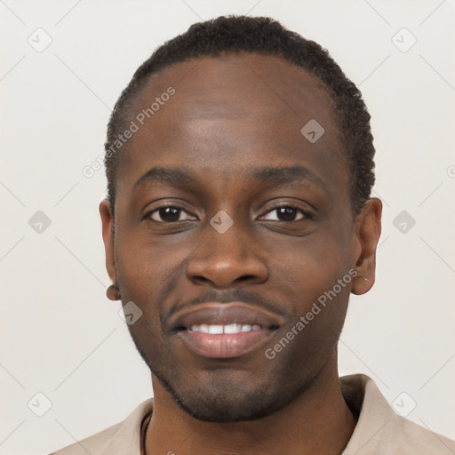 Joyful black young-adult male with short  brown hair and brown eyes