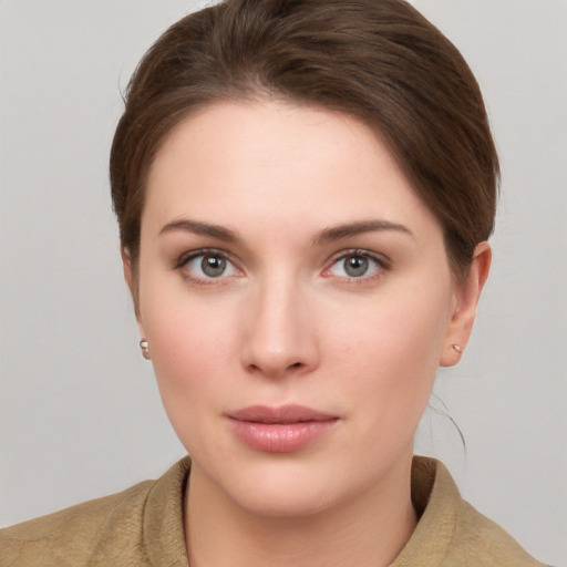 Neutral white young-adult female with short  brown hair and grey eyes