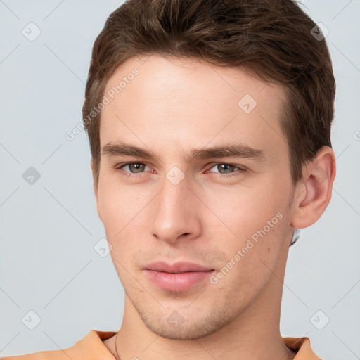 Neutral white young-adult male with short  brown hair and brown eyes