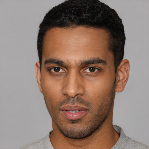 Neutral black young-adult male with short  black hair and brown eyes