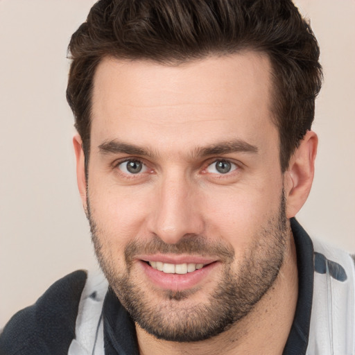 Joyful white young-adult male with short  brown hair and brown eyes