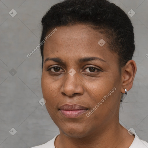 Joyful black young-adult female with short  brown hair and brown eyes