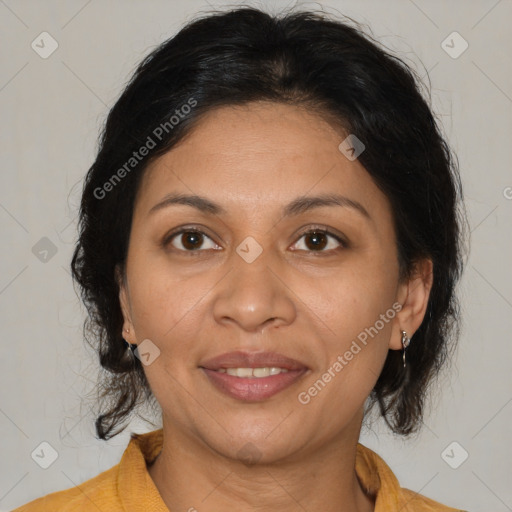 Joyful latino adult female with medium  brown hair and brown eyes