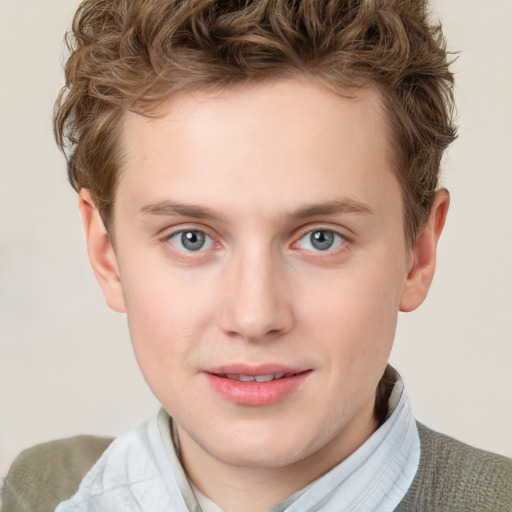 Joyful white young-adult male with short  brown hair and blue eyes