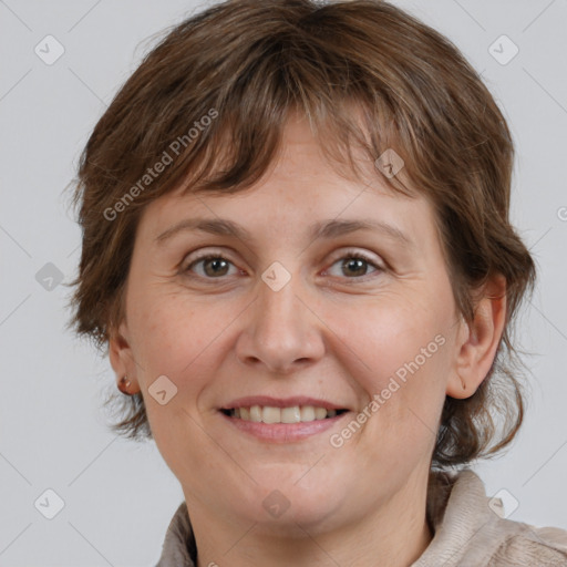 Joyful white adult female with medium  brown hair and brown eyes