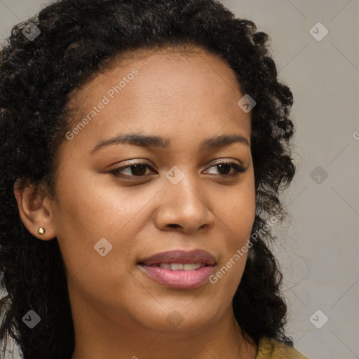 Joyful black young-adult female with long  brown hair and brown eyes