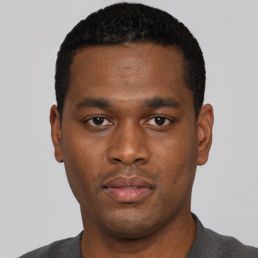 Neutral black young-adult male with short  black hair and brown eyes