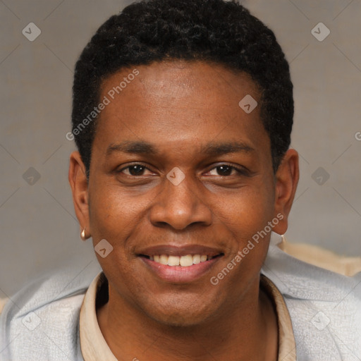 Joyful black young-adult male with short  black hair and brown eyes
