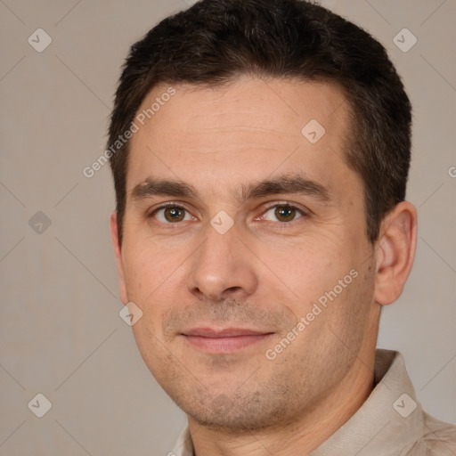 Joyful white adult male with short  brown hair and brown eyes