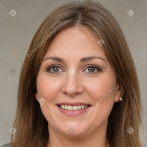 Joyful white adult female with long  brown hair and brown eyes