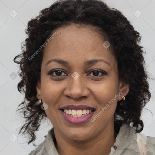 Joyful black adult female with long  brown hair and brown eyes