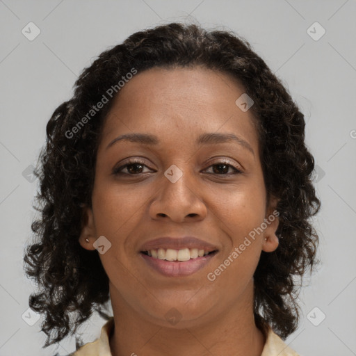 Joyful black young-adult female with medium  brown hair and brown eyes