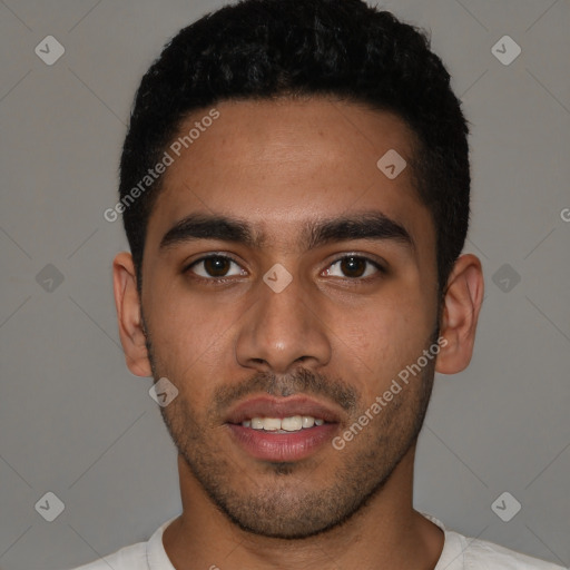 Joyful latino young-adult male with short  black hair and brown eyes