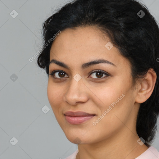 Joyful latino young-adult female with medium  brown hair and brown eyes