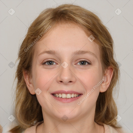 Joyful white young-adult female with medium  brown hair and blue eyes