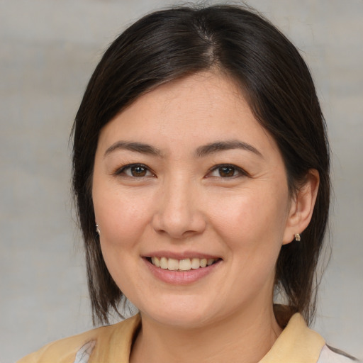 Joyful white young-adult female with medium  brown hair and brown eyes