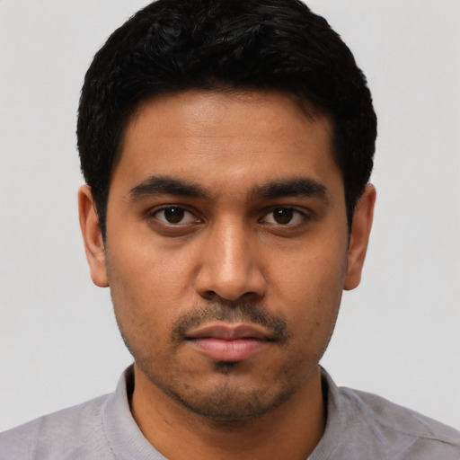 Neutral latino young-adult male with short  black hair and brown eyes