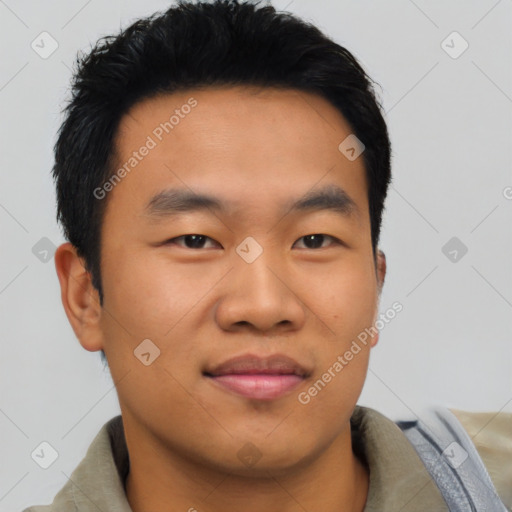 Joyful asian young-adult male with short  black hair and brown eyes