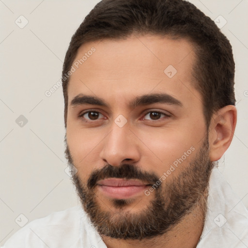 Joyful white young-adult male with short  brown hair and brown eyes