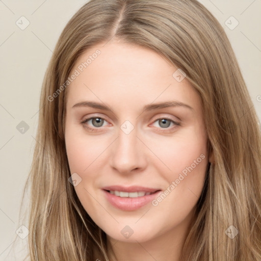 Joyful white young-adult female with long  brown hair and green eyes